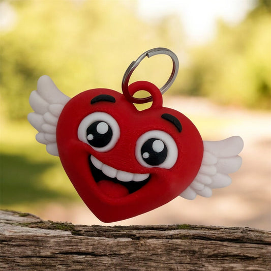 Llavero corazon feliz con alas impreso en 3D